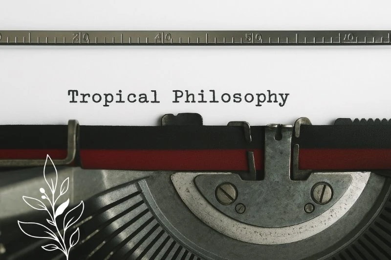 Tropical Philosophy written on a paper and a Typewriter